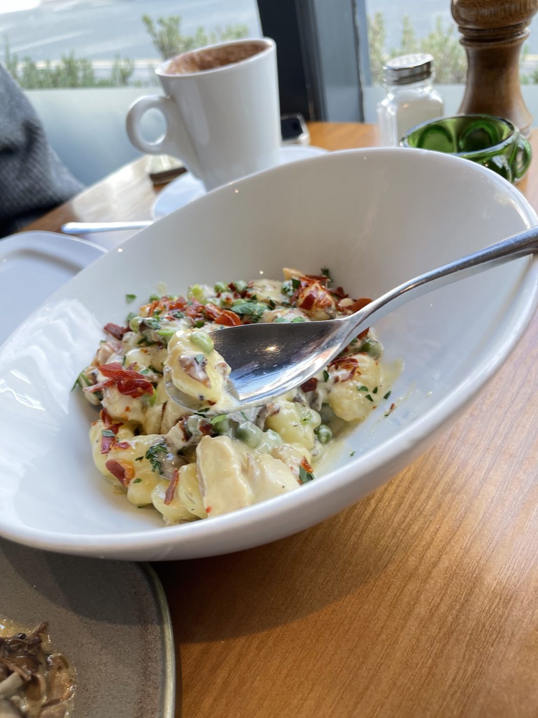 A creamy pasta dish in a white bowl