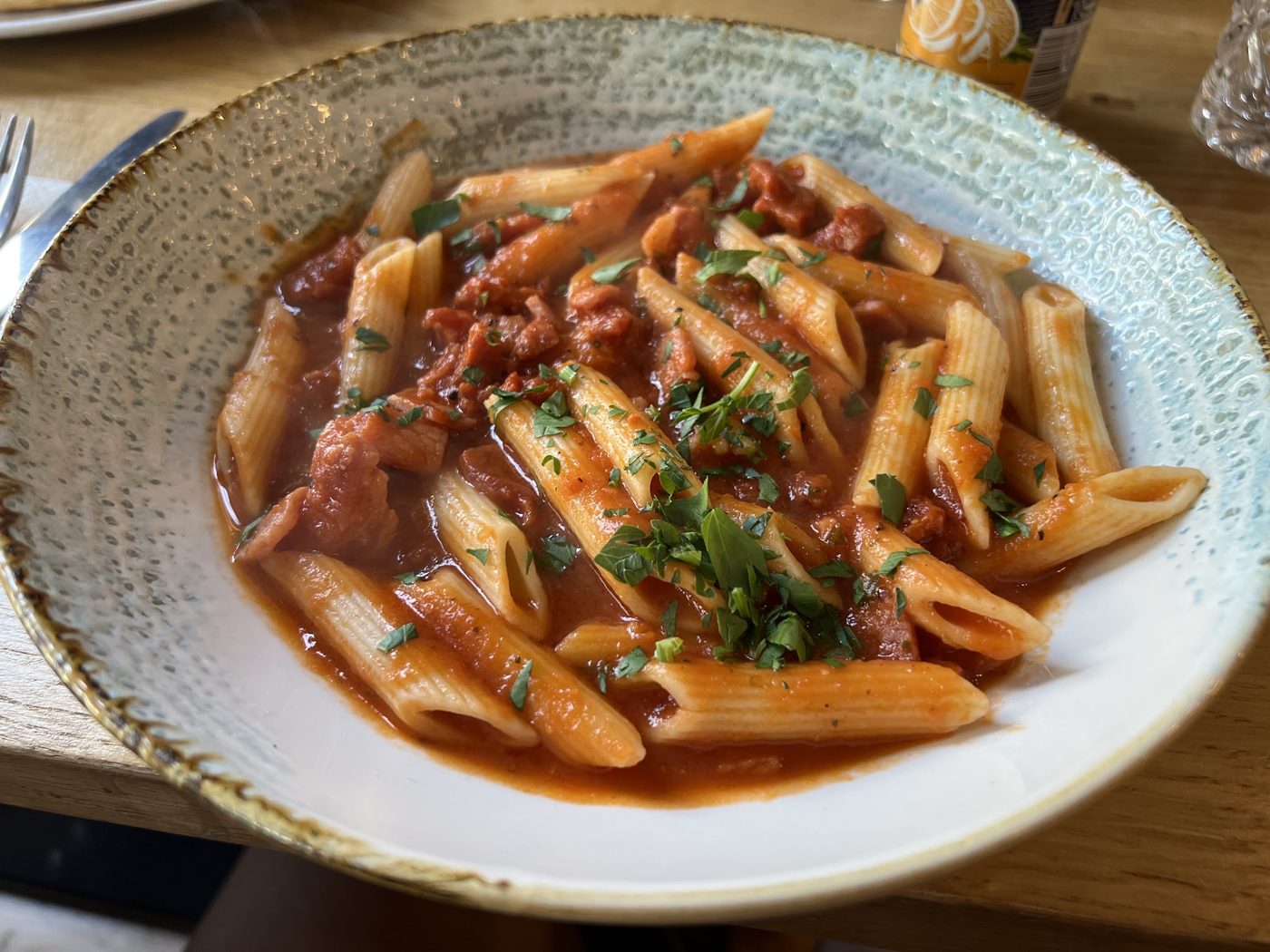 Penne in tomato sauce with herbs